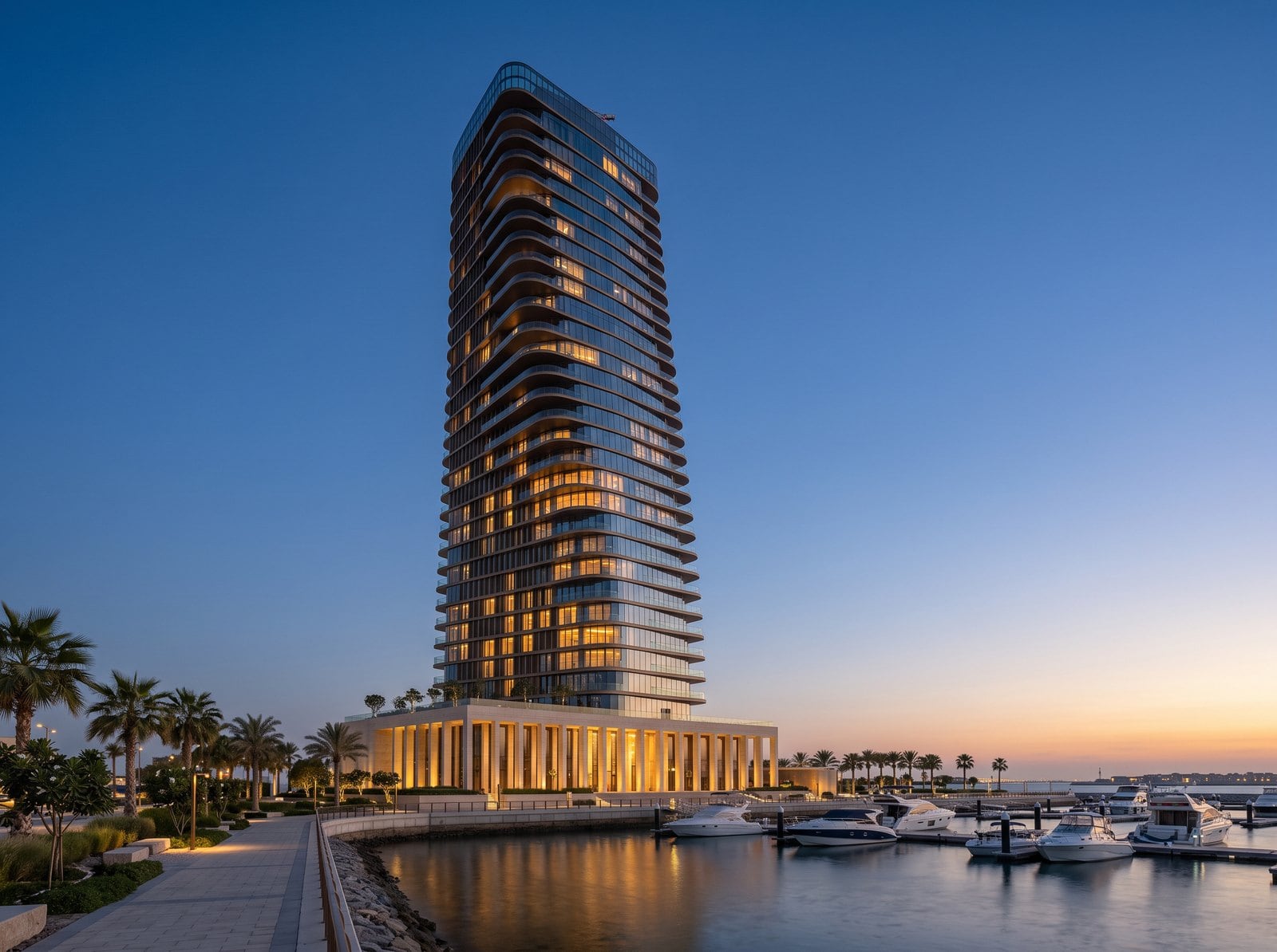 Altair seen from the marina at golden hour, every floor turned a little further toward the sea
